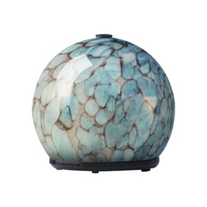 Devanti 240ml Glass Ultrasonic Aroma Diffuser in blue emitting a fine mist on a wooden bedside table