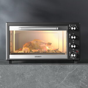 Close-Up Of A Chicken Roasting On The Rotisserie Fork Inside Devanti Convection Oven