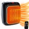 1200W Mini Ceramic Fan Heater With Remote Control Plugged Into A Wall Outlet