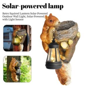 Retro Squirrel Lantern Solar Outdoor Wall Light hanging illuminated at night on a timber garden fence