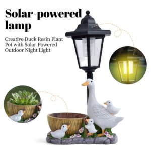 Duck resin flower pot solar outdoor light showing mother duck sculpture