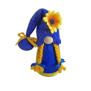 Sunflower gnome doll with blue hat and braids on a bright window sill