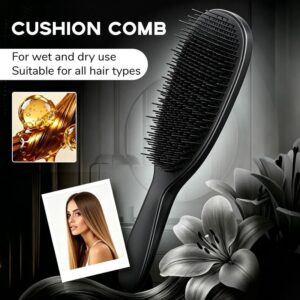 Detachable Silicone Cushion scalp massage comb black resting flat on a contemporary bathroom counter.