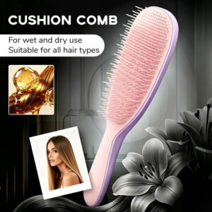 Detachable Silicone Cushion massage brush purple pink detangler resting flat on a contemporary bathroom counter.