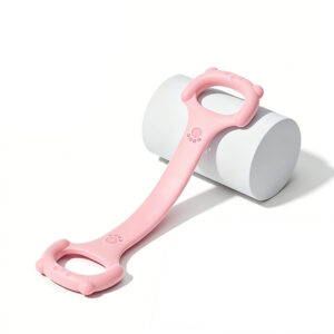 Pink 40lbs resistance band with one piece construction resting on a purple yoga mat