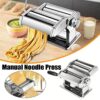 Manual Stainless Steel Noodle Maker Machine Clamped To A Wooden Kitchen Bench