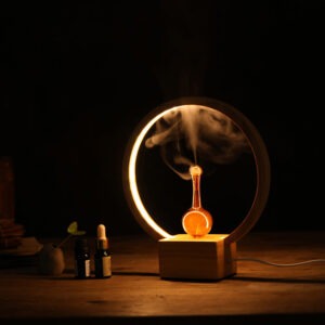 Luna waterless nebuliser with glowing LED ringlight and amber glass reservoir on a wooden table.