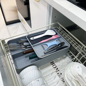 Lightweight Kitchen Tableware Rack Packed With Small Bowls, Cooking Spoons, And Plates Near A Sink Area.