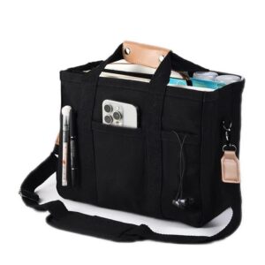 Black large capacity multi compartment tote bag standing upright in canvas fabric