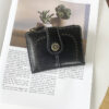 Black Vintage Pu Leather Womens Short Wallet Cut Out Design – Great Shop Front View Of Closed Black Vintage Pu Leather Womens Short Wallet Cut Out Design With Decorative Clasp On White Background