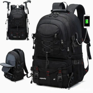 Black 40L Large Capacity Travel Backpack Water Resistant packed and standing upright against an outdoor backdrop