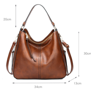 Side Angle View Of The Brown Fashion Large Capacity Handbag Showing The 13Cm Deep Base And Spacious Zipper Opening.