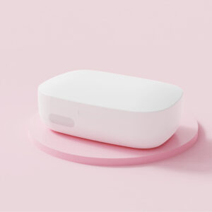 White ultrasonic contact lens cleaner machine with LED display open on a bathroom vanity